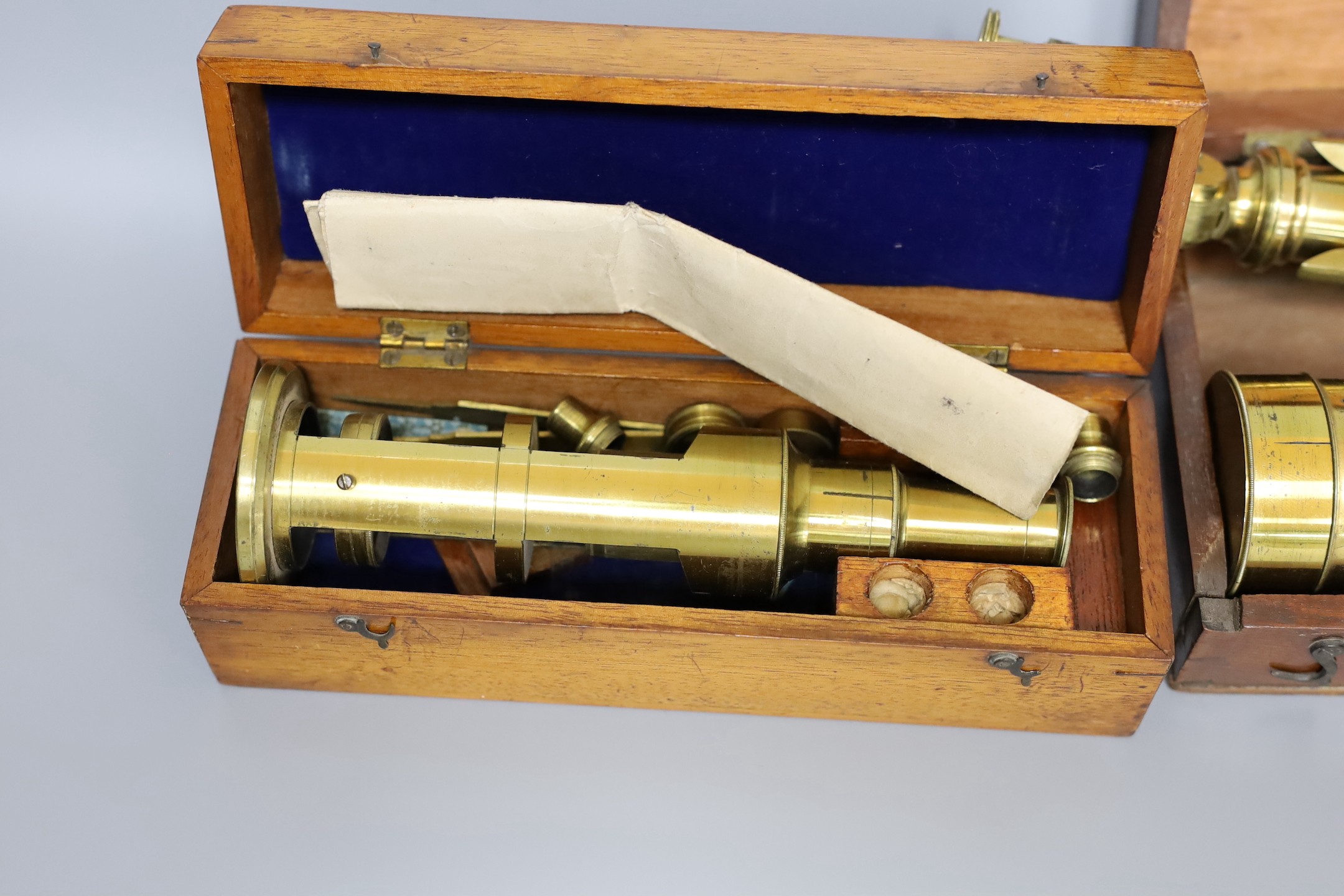A Victorian Gilbert & Son portable achromatic telescope, boxed and a compound microscope